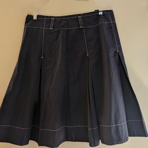 DKNY women's navy blue pleated skirt with white stitching accents